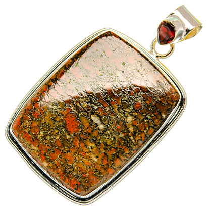 Sterling silver dinosaur bone pendant with garnet top bail, rectangular stone in silver frame