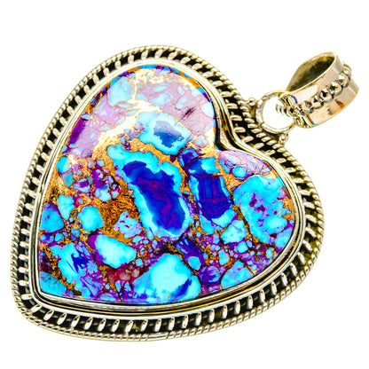 Heart-shaped turquoise inlay pendant with ornate silver-tone border and bail