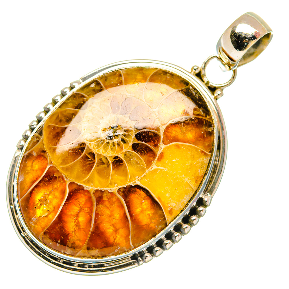 Round sterling silver fossil pendant with golden and amber swirls