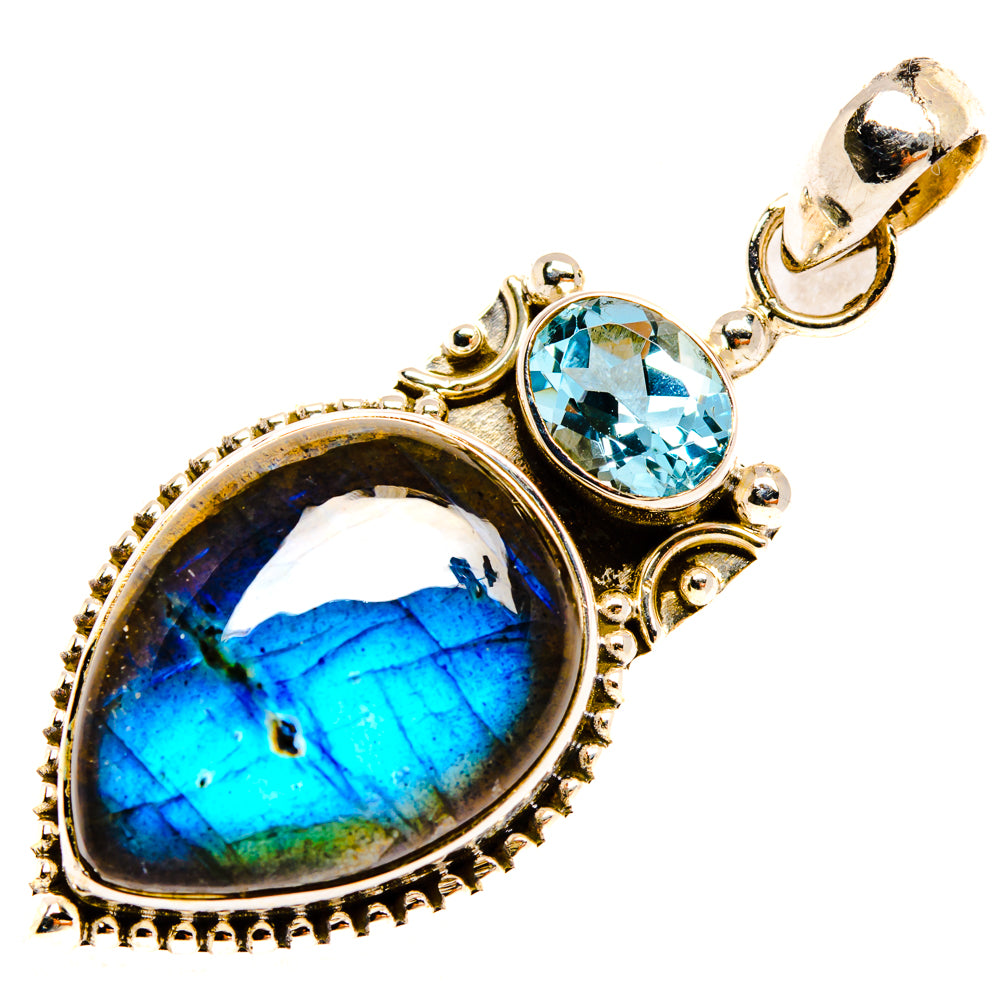Oval labradorite pendant with round blue topaz, 925 silver bail and decorative border