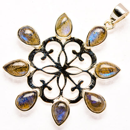 Sterling silver snowflake pendant with black enamel and eight teardrop labradorite stones