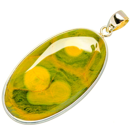 Oval ocean jasper pendant in gold-tone bezel, sterling silver frame and bail