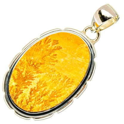 Oval psilomelane dendrite pendant with yellow-orange cabochon and silver bezel