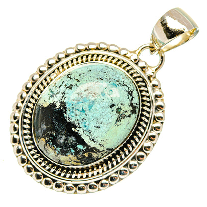 Turquoise cabochon pendant with decorative sterling silver frame and top bail