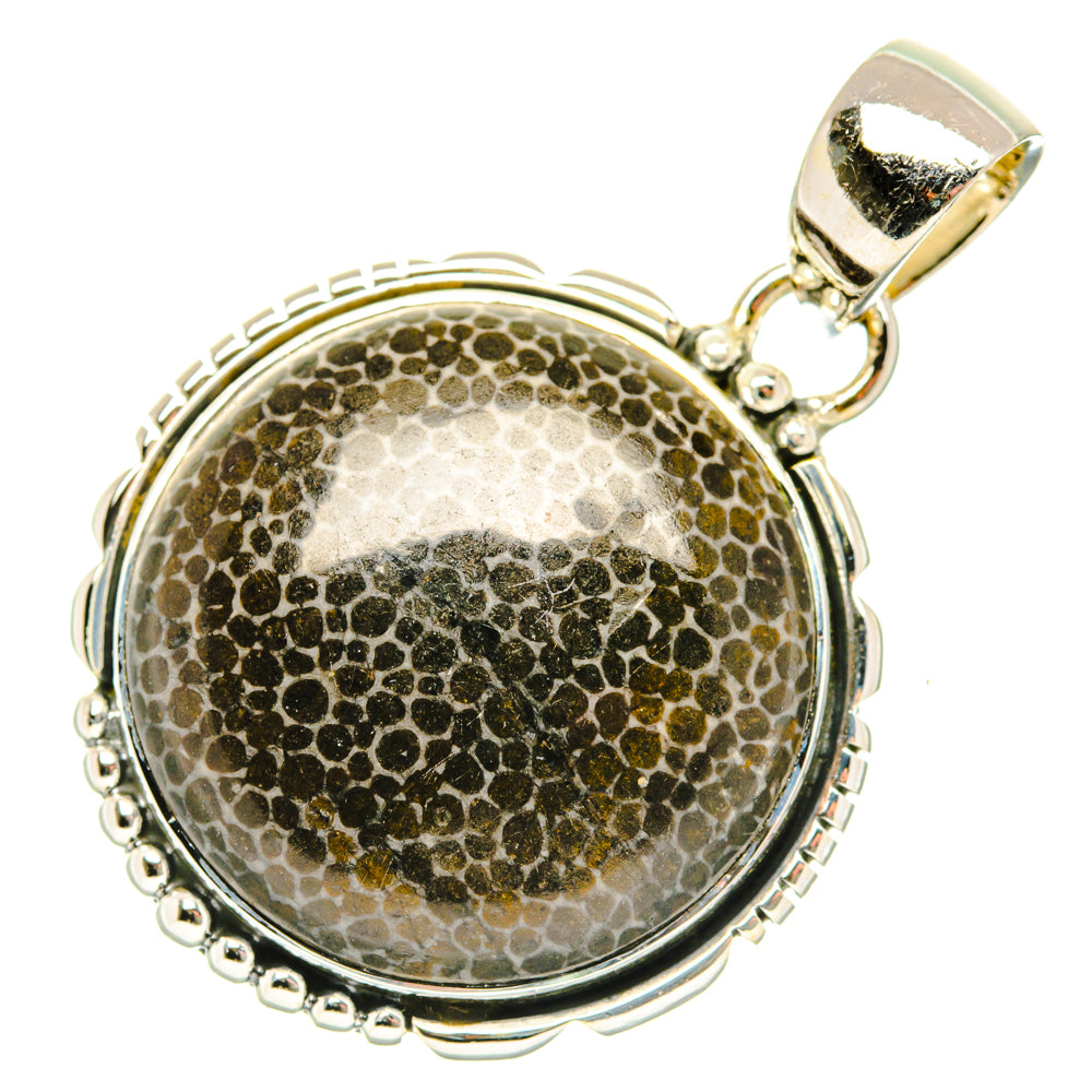 Round sterling silver pendant with mottled stingray-coral cabochon