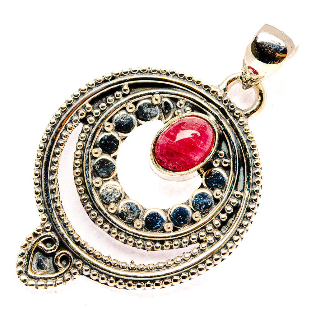 Sterling silver pendant with pink-red round stone in ornate circular halo setting