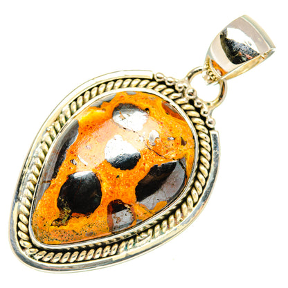 Bauxite pendant in teardrop bezel with orange-and-black stone, sterling silver bail