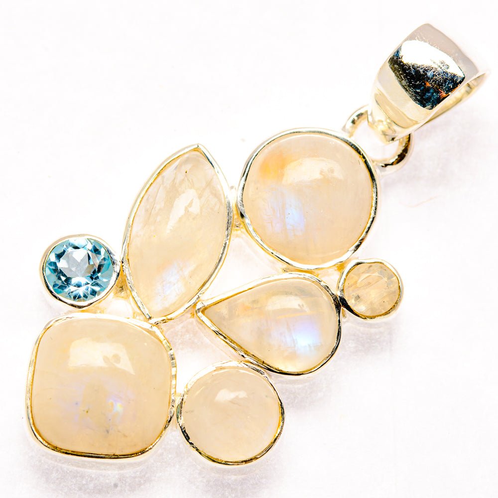 Sterling silver moonstone cluster pendant with blue topaz round accent
