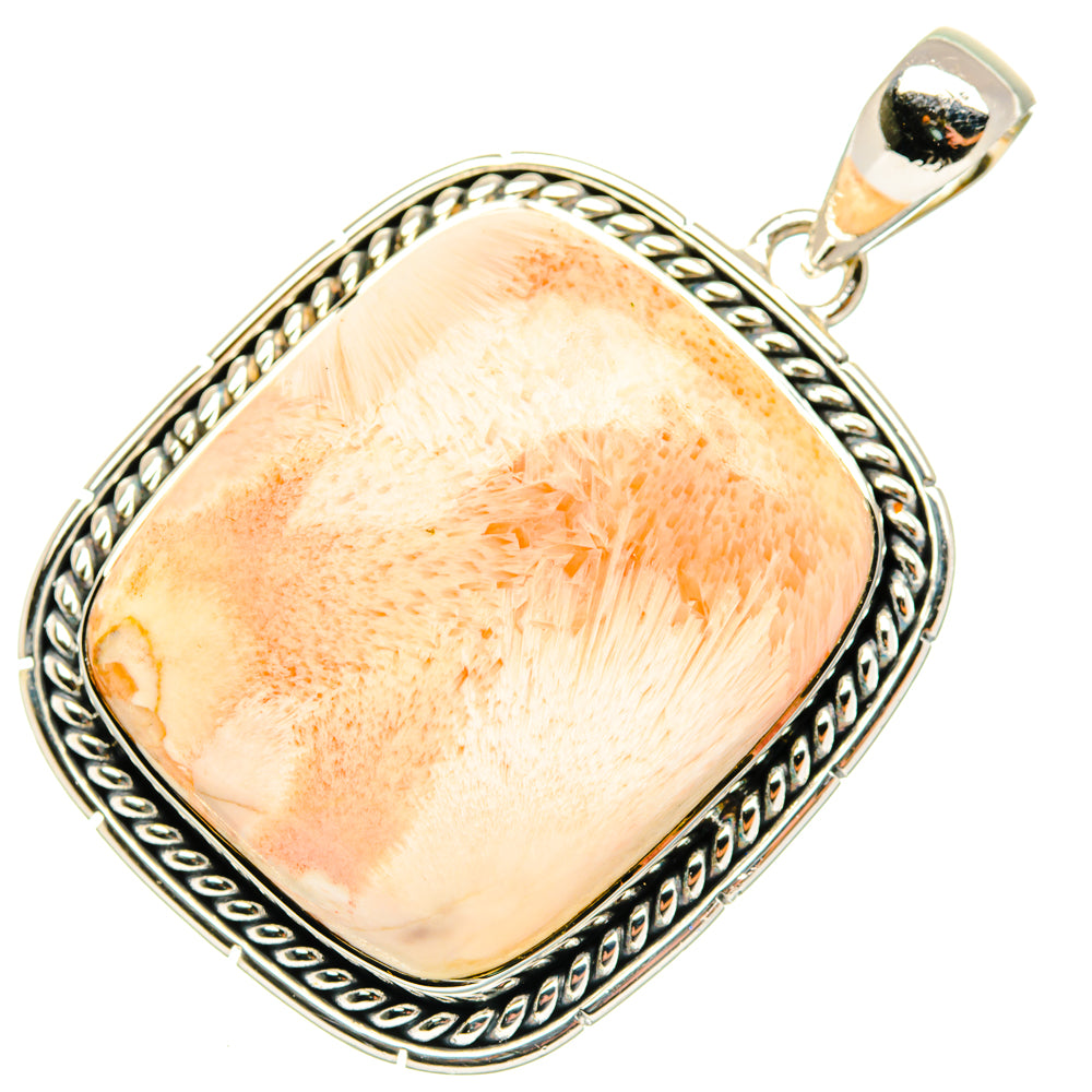 Sterling silver pendant with oval peach selenite-like stone and ornate rope border