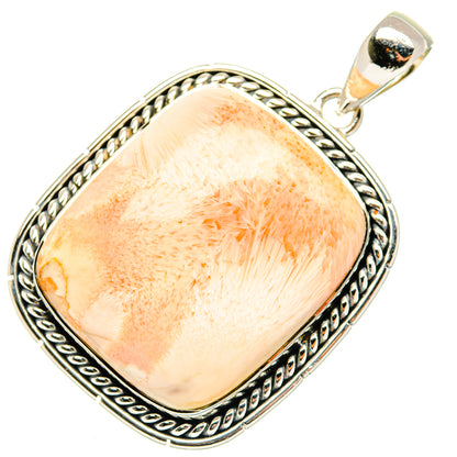 Sterling silver pendant with oval peach selenite-like stone and ornate rope border