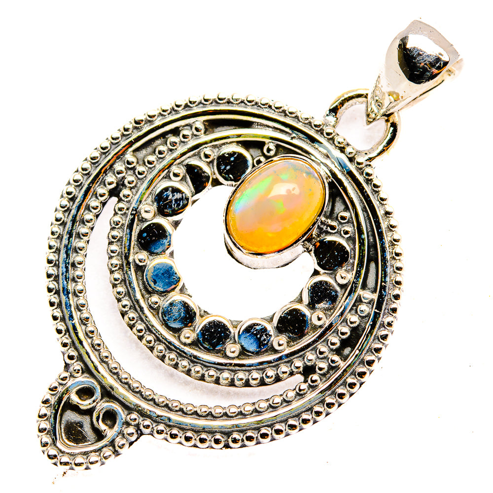 Sterling silver pendant with oval opal center and dark blue stone halo in round setting
