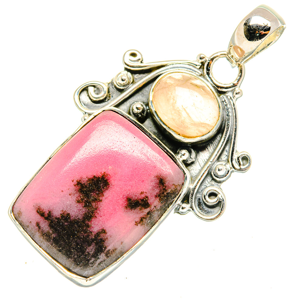 Sterling silver pendant with pink rhodonite and peach rose quartz cabochons in ornate setting