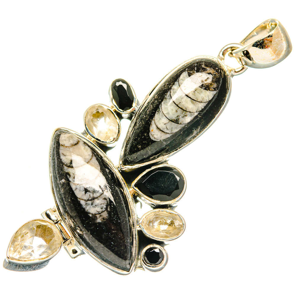 Marbled black and white pendant with gold-tone bail and bezel-set heart and teardrop accents