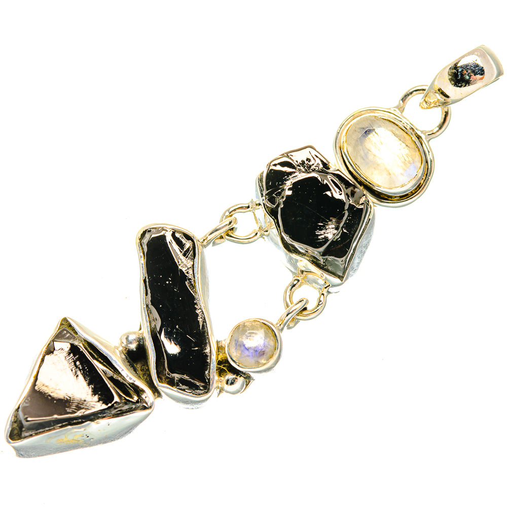 Sterling silver pendant on chain with rough black stones and round moonstone cabochons