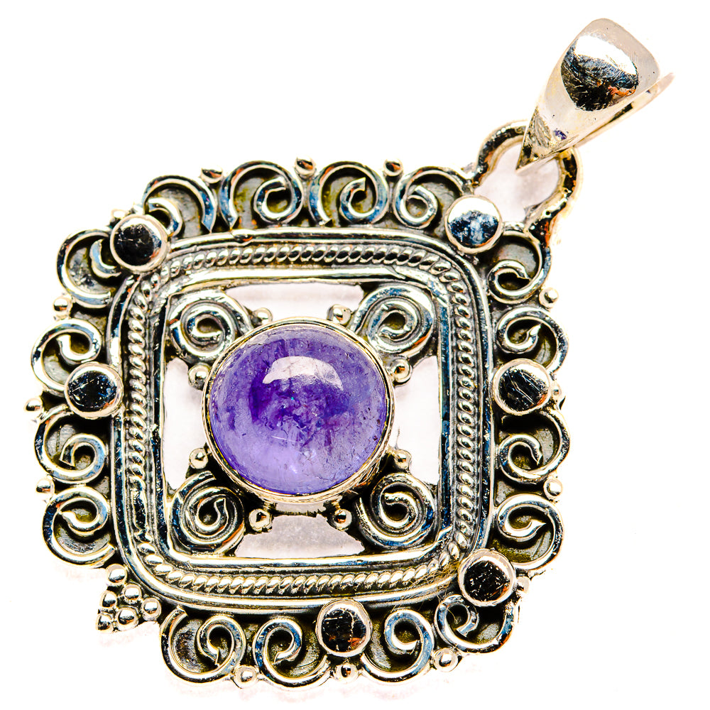 Ornate tanzanite pendant with round purple gemstone, silver filigree and blue stones