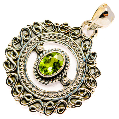 Sterling silver peridot pendant with green stone in ornate filigree oval setting