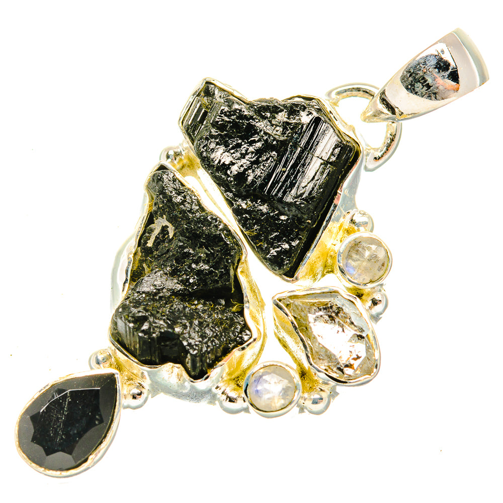Rough black tourmaline and clear gemstone pendant in silver with top bail and bezel frames