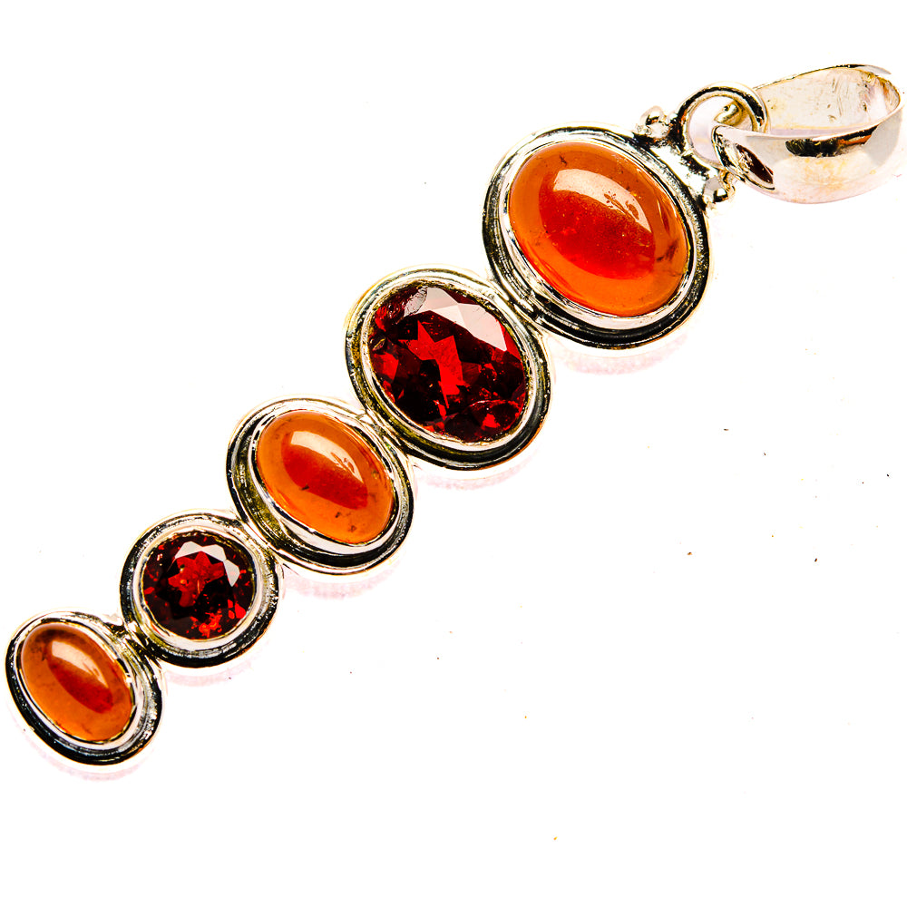 Sterling silver pendant with round orange and red stones and top loop bail