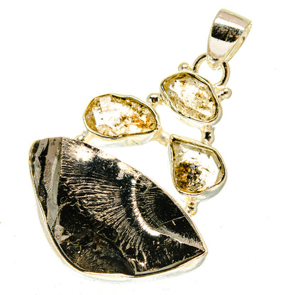 Sterling silver shungite pendant with dark rough stone and three oval faceted crystals