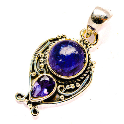 Sterling silver tanzanite pendant with round blue-violet stone and oval accent, ornate frame