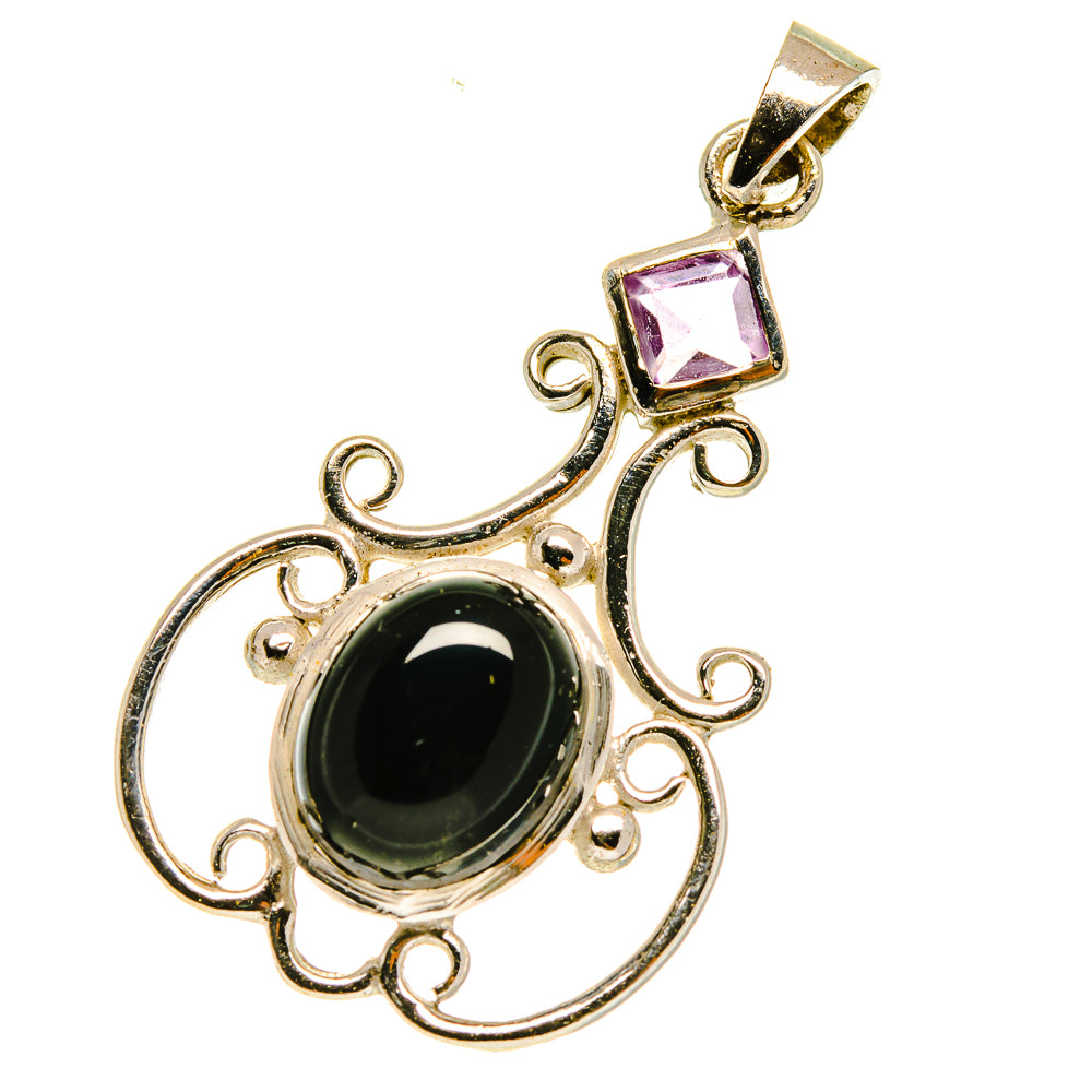 Sterling silver pendant with black onyx oval and square purple gemstone in filigree frame