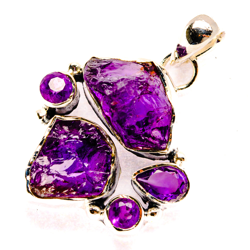 Amethyst pendant with rough purple stones, round accents, and silver loop bail