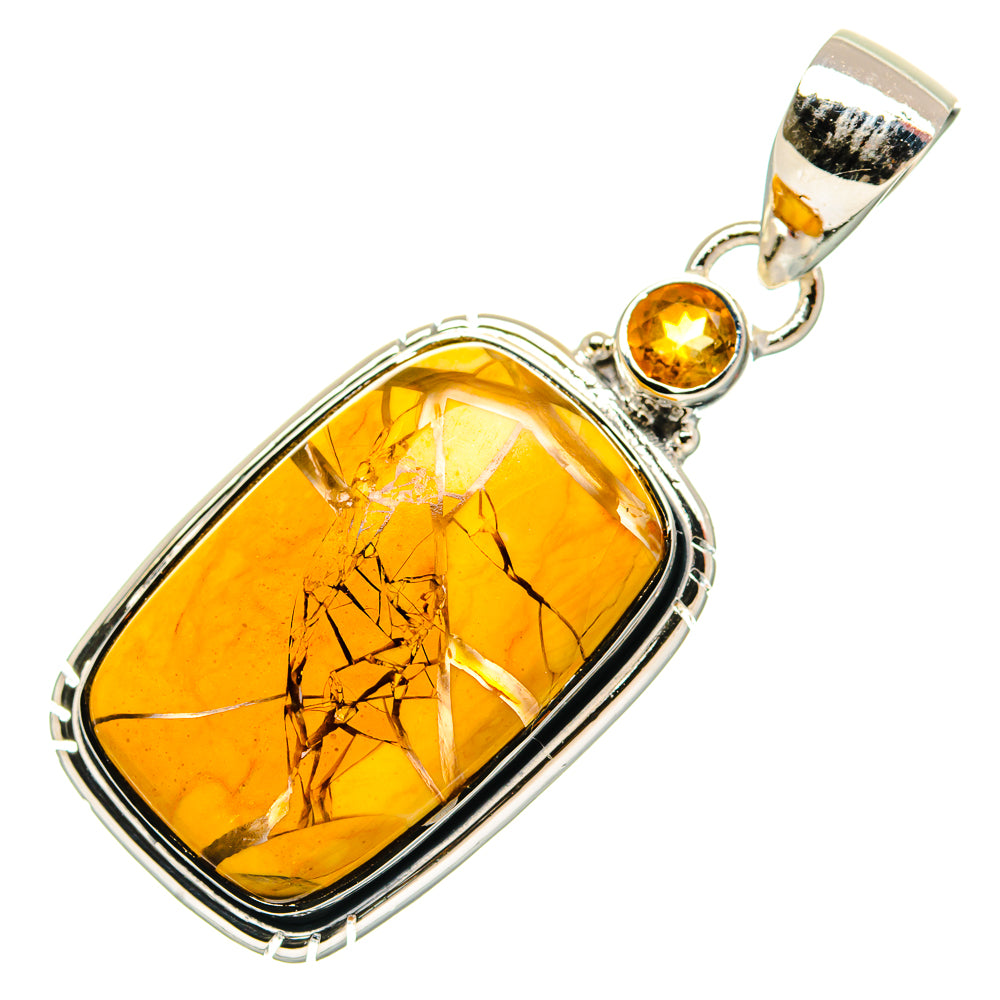 Oval amber gemstone pendant with citrine accents in silver setting