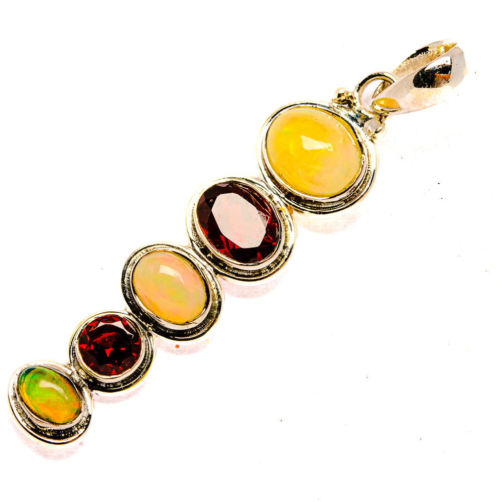 Sterling silver pendant with round opal and red garnet cabochons, linked row
