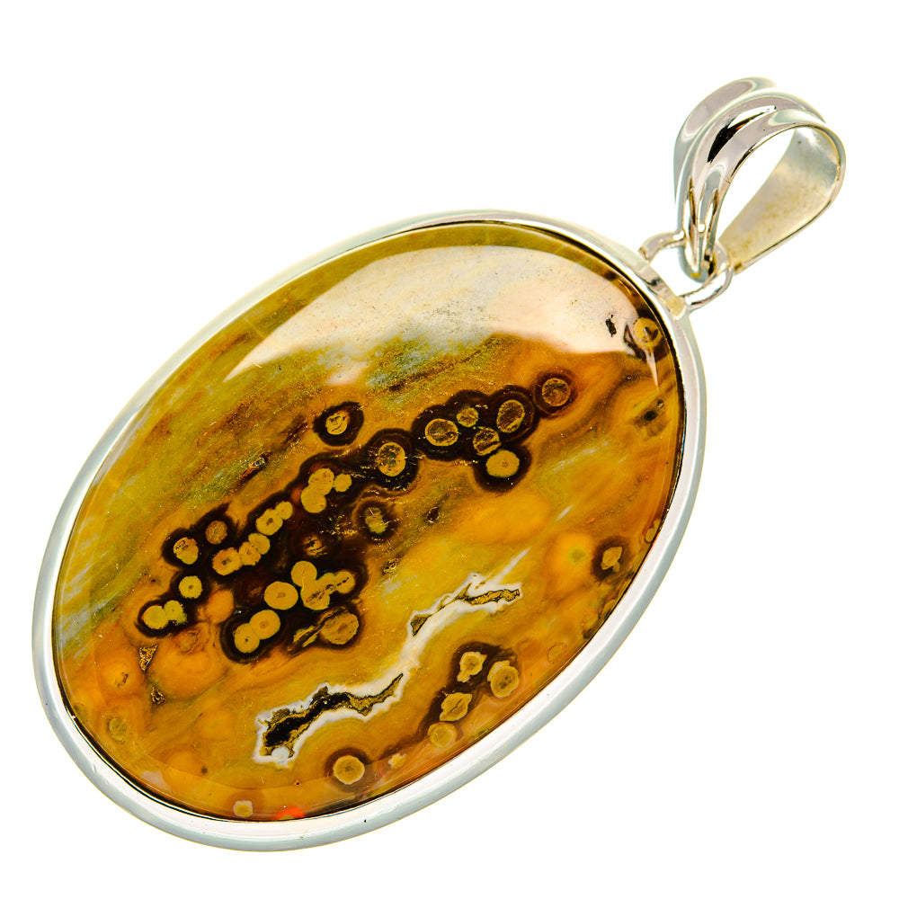 Oval ocean jasper pendant in sterling silver bezel with patterned yellow and green stone.