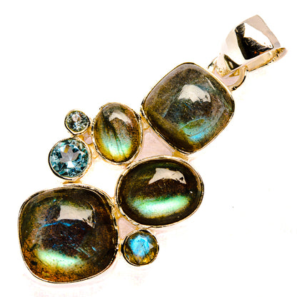 Sterling silver pendant with labradorite ovals and blue topaz accents
