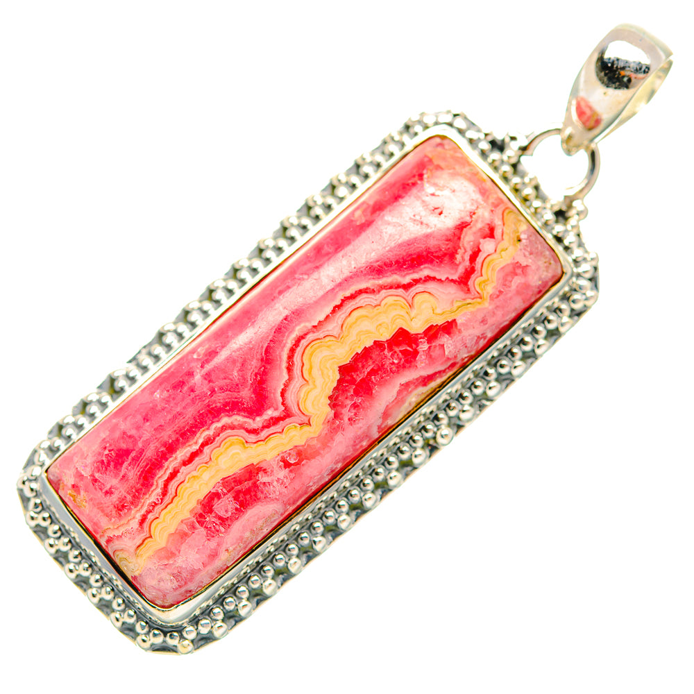 Rectangular rhodochrosite pendant with pink stone and silver beaded border, bail at top