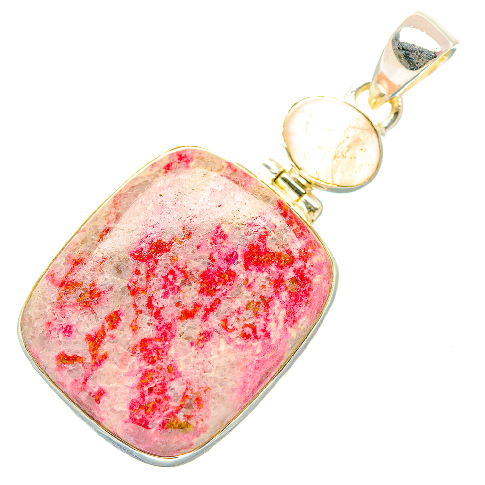 Rose quartz pendant with pink speckled gemstone in silver bezel, bail at top