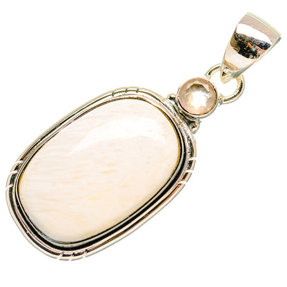 Silver gemstone pendant with oval white cabochon, round pink stone, and top bail