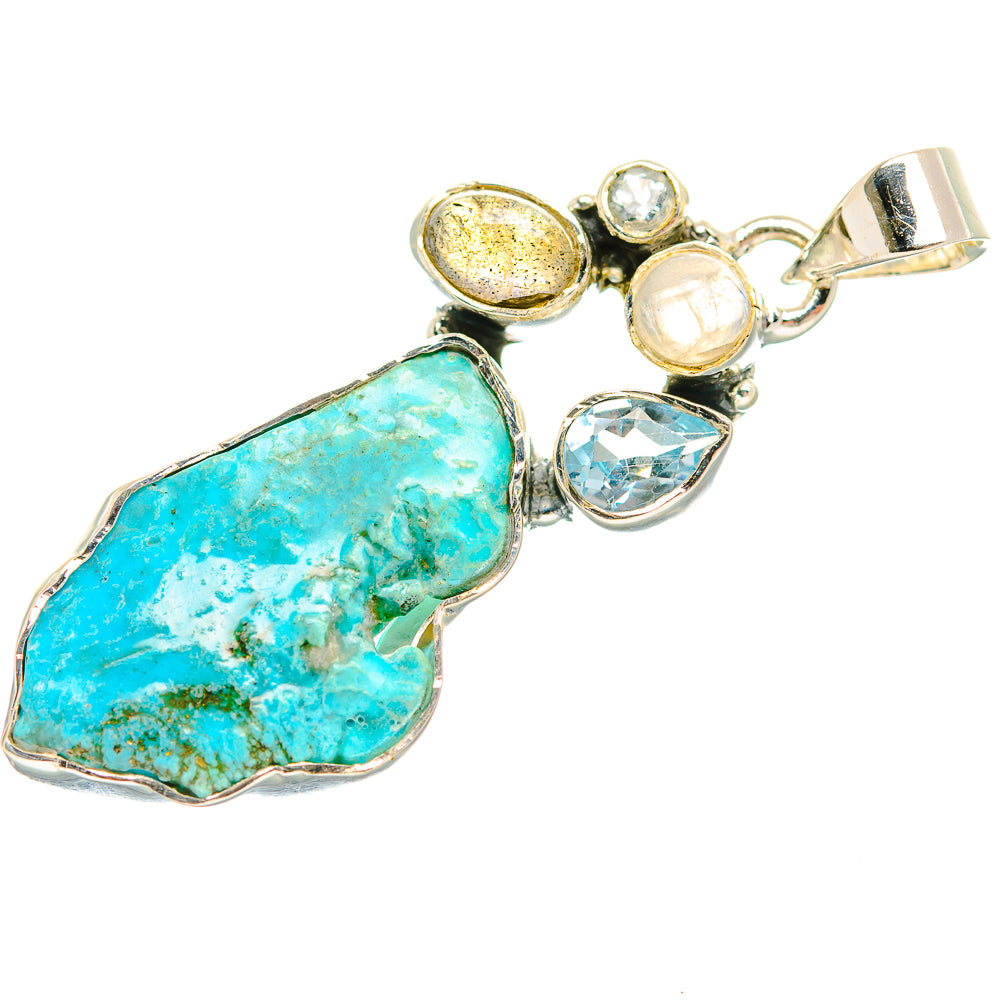 Sterling silver gemstone pendant with rough turquoise teardrop stone and blue iridescent accents