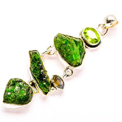 Silver-tone peridot pendant with rough green gemstones and teardrop settings