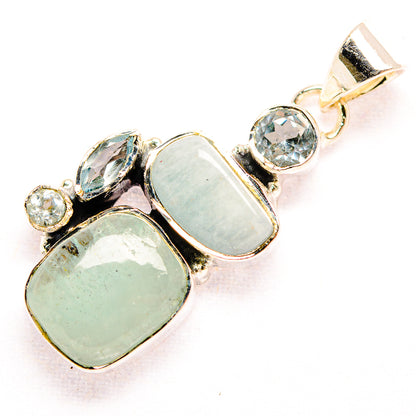 Sterling silver pendant with rectangular opalescent aquamarine and round blue accents