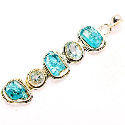 Sterling silver pendant with row of five blue and clear stones, top bail loop