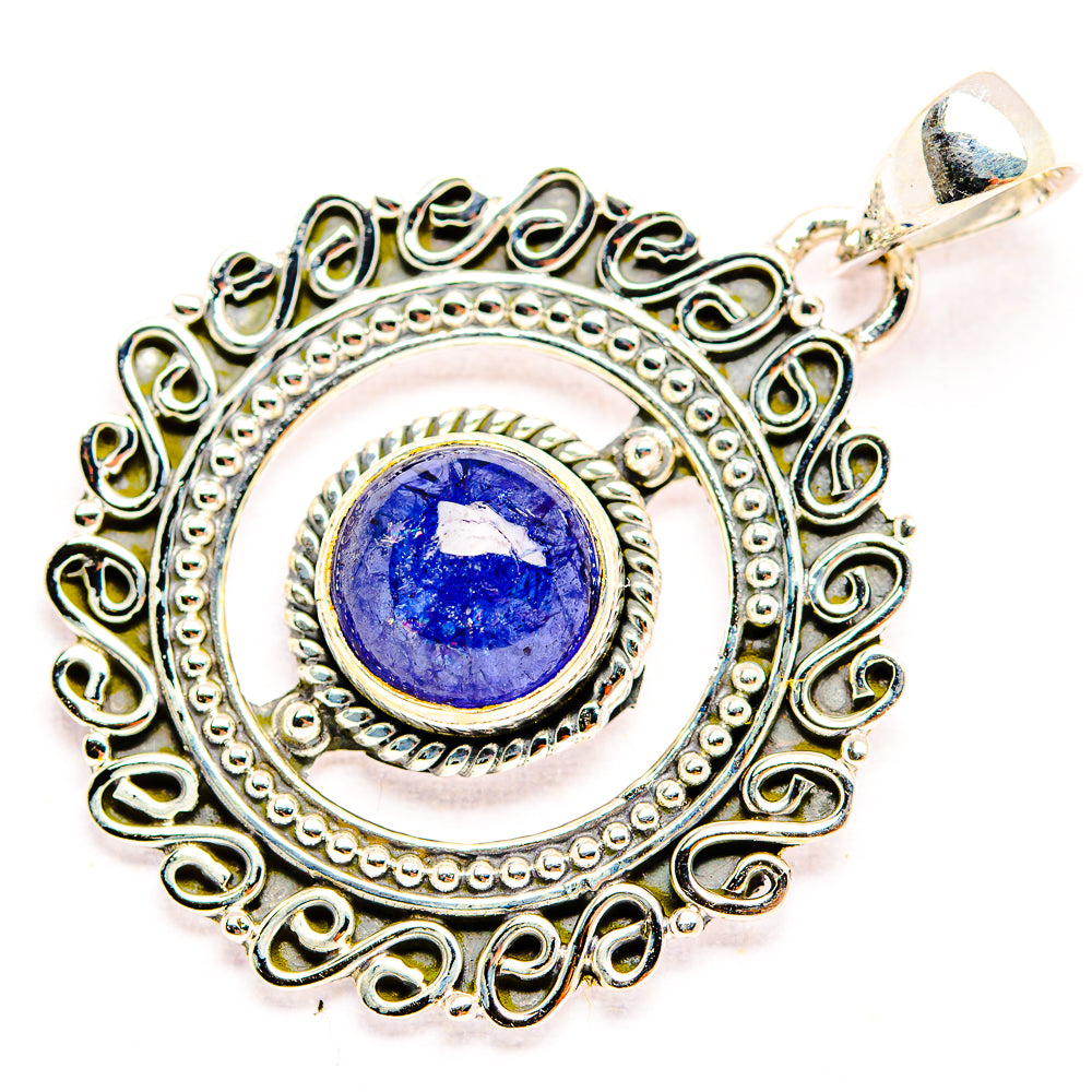 Tanzanite pendant with round blue-purple gemstone framed by detailed sterling silver