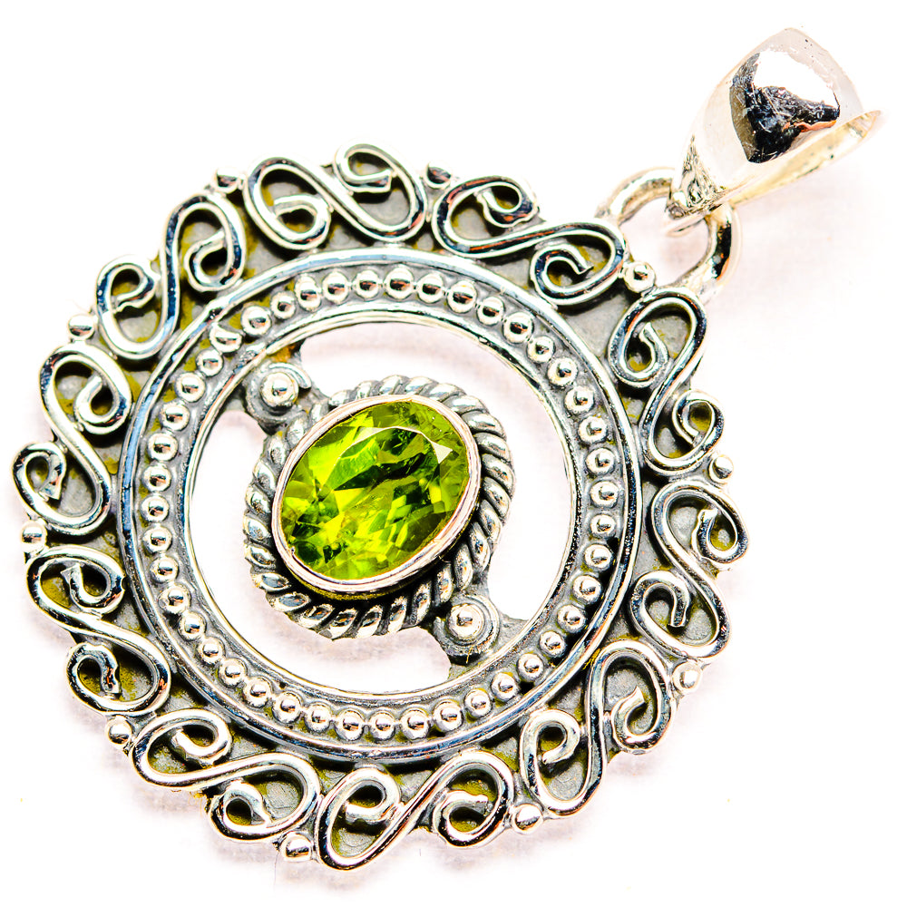 Peridot pendant with round green gemstone in ornate 925 sterling silver frame