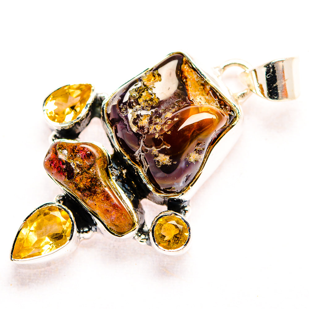 Sterling silver pendant with fire agate center and citrine teardrop side stones