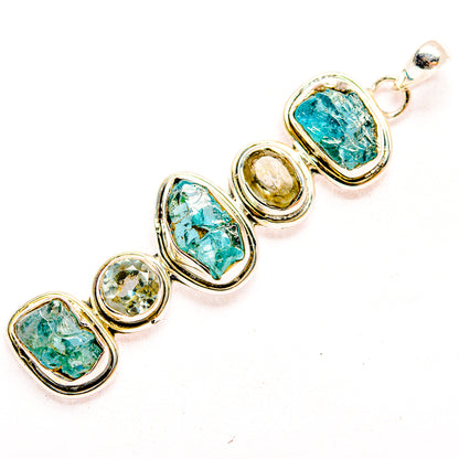 Oval rough apatite pendant bracelet with blue-green stones and silver links