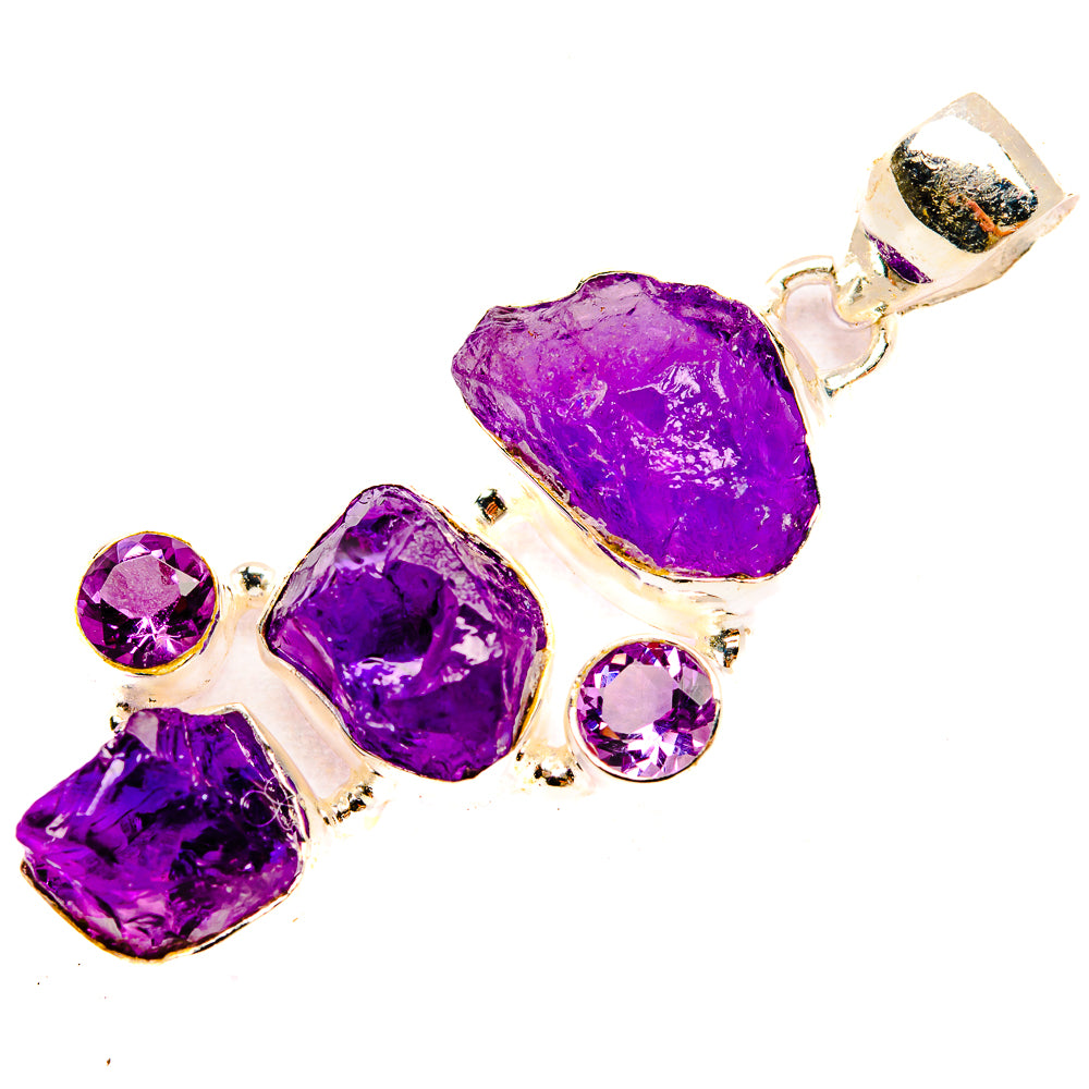 Sterling silver amethyst pendant with rough purple center stone, side rounds, and top bail