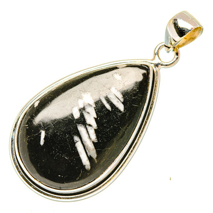 Sterling silver teardrop pendant with black stone and white carved pattern