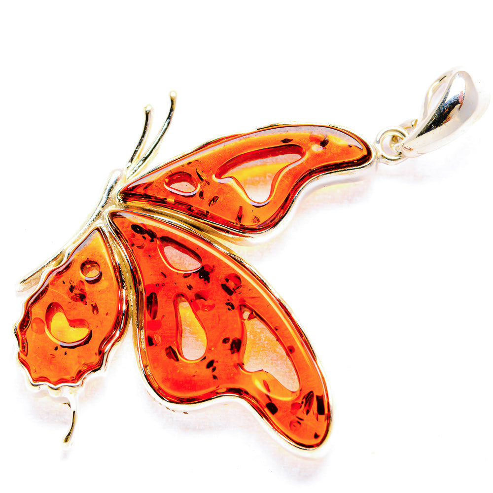 Amber butterfly pendant in 925 sterling silver with orange natural resin details