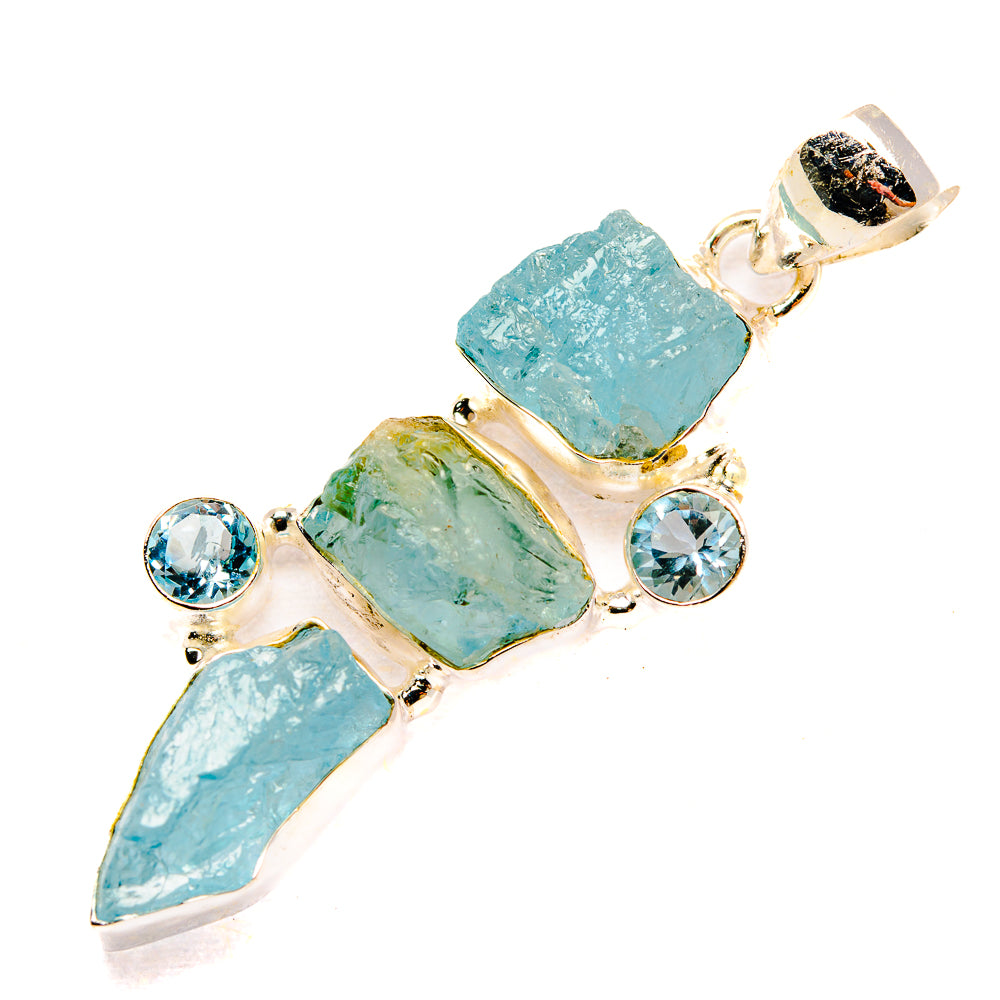 Rough aquamarine-style pendant with blue round accents, sterling silver setting