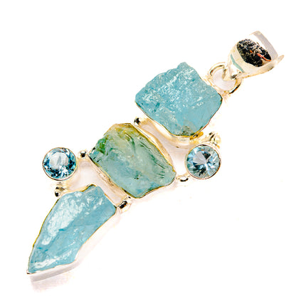 Rough aquamarine-style pendant with blue round accents, sterling silver setting