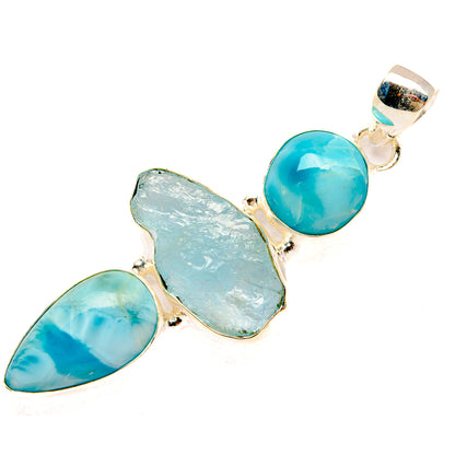 Larimar pendant in 925 sterling silver with round blue cabochon and rough stone inlay
