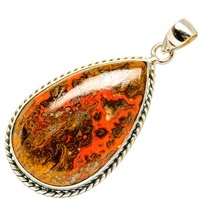 Orange-brown teardrop agate pendant with detailed silver border and top bail