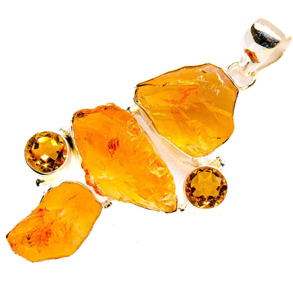 Rough carnelian pendant with three rough amber stones and two round orange accents in silver