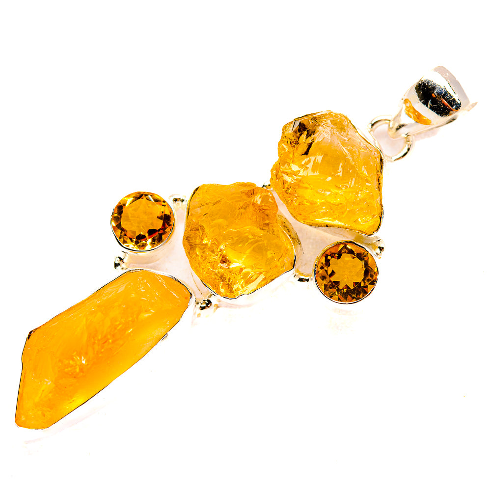 Rough carnelian pendant with orange teardrop, nuggets, and round stones in sterling silver